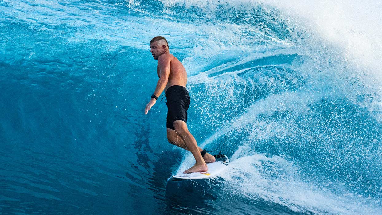 Mick Fanning surfing in the Mirage Activate Compression Liner Boardshort 