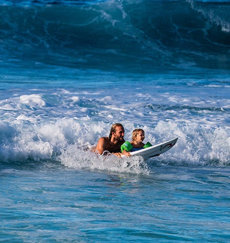 Owen Wright surfing with his son