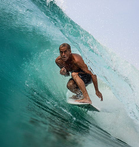 Tom Curren getting barrelled by a wave