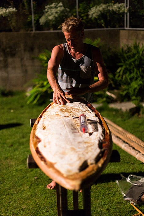 Tom Curren fixing a surfboard